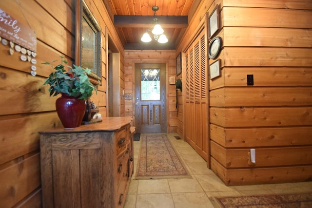 28716 Kilkare Rd, Danbury, WI 54830 - doorway to outside with wooden walls, a wood ceiling with exposed beams, a chandelier, and light tile patterned flooring