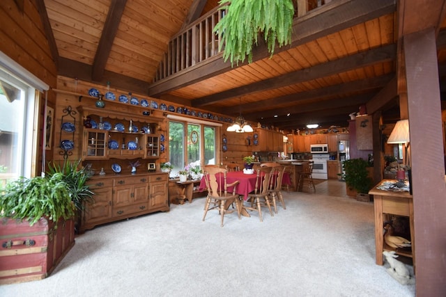 28716 Kilkare Rd, Danbury, WI 54830 - dining area with a wood ceiling with exposed beams, light colored carpet, a chandelier, and wooden walls