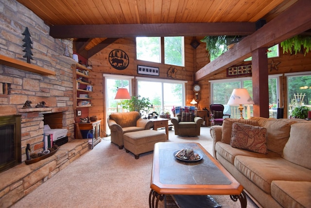 28716 Kilkare Rd, Danbury, WI 54830 - carpeted living area with wooden walls, a wood ceiling with exposed beams, a stone fireplace, and high vaulted ceiling
