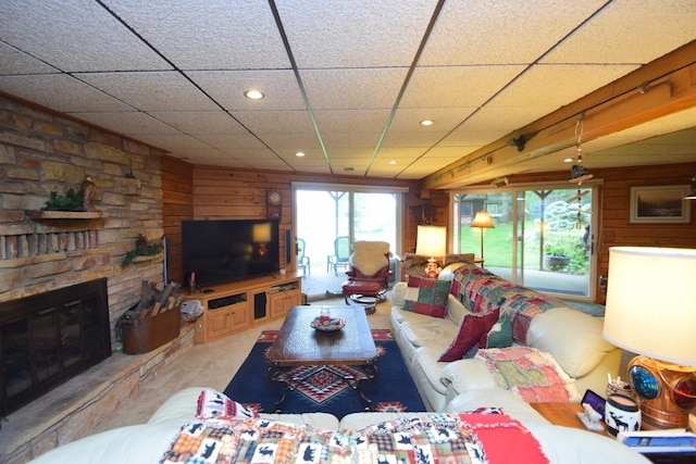 28716 Kilkare Rd, Danbury, WI 54830 - living area featuring wooden walls, recessed lighting, a drop ceiling, and a fireplace