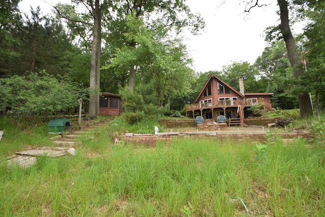 28716 Kilkare Rd, Danbury, WI 54830 - view of yard featuring a deck and view of wooded area