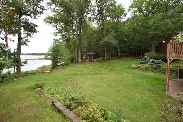 28716 Kilkare Rd, Danbury, WI 54830 - view of green lawn with a deck with water view and an outbuilding