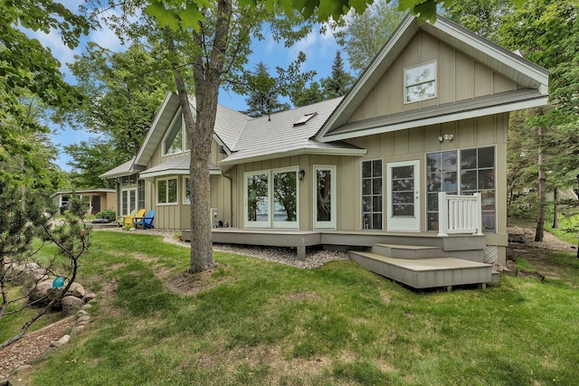 13188 Chicago Club Ln NE, Alexandria, MN 56308 - back of property featuring board and batten siding and a yard