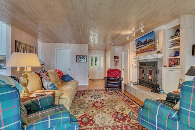 13188 Chicago Club Ln NE, Alexandria, MN 56308 - living area with wood ceiling, wood walls, wood finished floors, and a fireplace
