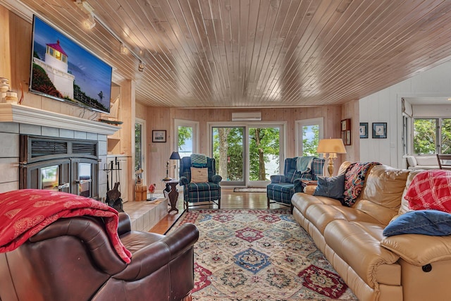 13188 Chicago Club Ln NE, Alexandria, MN 56308 - living area with plenty of natural light, wooden ceiling, wood walls, and a tile fireplace