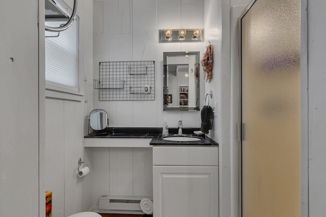 13188 Chicago Club Ln NE, Alexandria, MN 56308 - full bath with a baseboard heating unit, a stall shower, and vanity