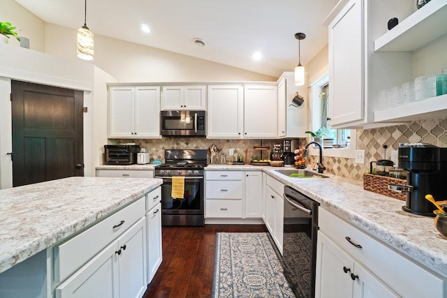 1115 Timber Path, Menomonie, WI 54751 - kitchen with appliances with stainless steel finishes, pendant lighting, white cabinets, vaulted ceiling, and recessed lighting