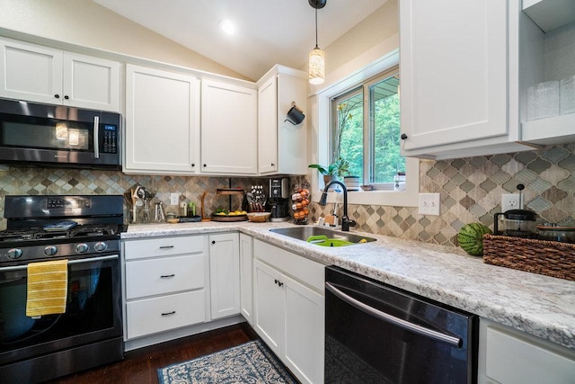 1115 Timber Path, Menomonie, WI 54751 - kitchen featuring gas stove, stainless steel microwave, dishwasher, lofted ceiling, and white cabinets