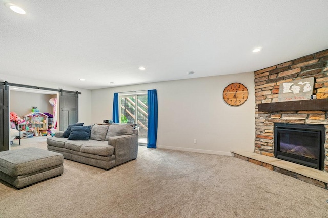 1115 Timber Path, Menomonie, WI 54751 - carpeted living room featuring a barn door, recessed lighting, and a fireplace