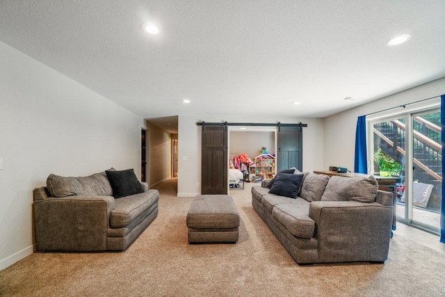 1115 Timber Path, Menomonie, WI 54751 - living area featuring a barn door, light carpet, recessed lighting, and a textured ceiling