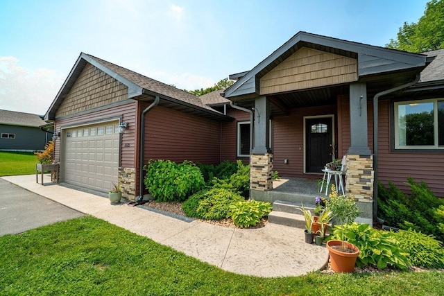 1115 Timber Path, Menomonie, WI 54751 - craftsman-style home with an attached garage, driveway, and stone siding