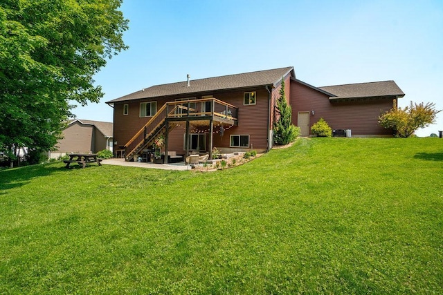 1115 Timber Path, Menomonie, WI 54751 - rear view of house featuring stairs, a deck, a patio area, and a lawn