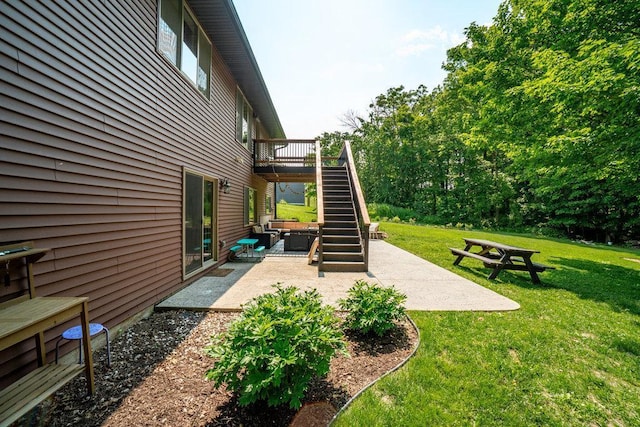 1115 Timber Path, Menomonie, WI 54751 - view of grassy yard with stairway, a patio area, and a deck