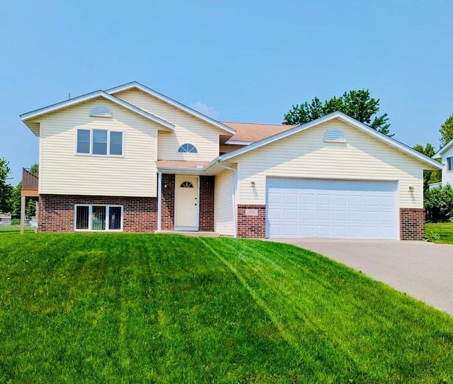 205 4th St NW, Saint Michael, MN 55376 - split level home with brick siding, a front lawn, a garage, and driveway