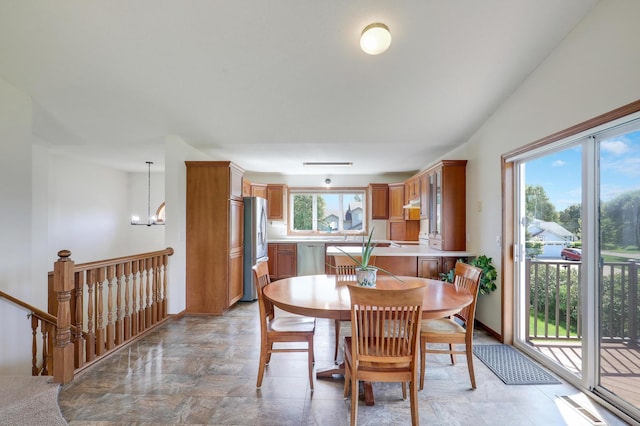 205 4th St NW, Saint Michael, MN 55376 - dining area featuring a chandelier and baseboards