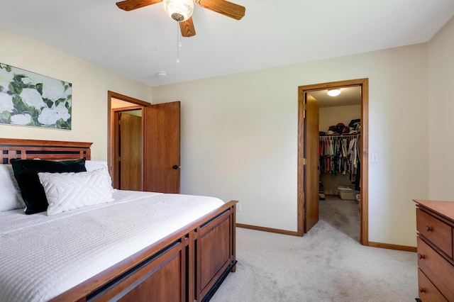 205 4th St NW, Saint Michael, MN 55376 - bedroom with light carpet, a spacious closet, ceiling fan, and a closet