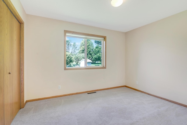 205 4th St NW, Saint Michael, MN 55376 - unfurnished bedroom featuring light colored carpet and a closet