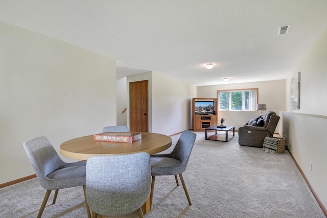 205 4th St NW, Saint Michael, MN 55376 - dining area with light colored carpet and baseboards