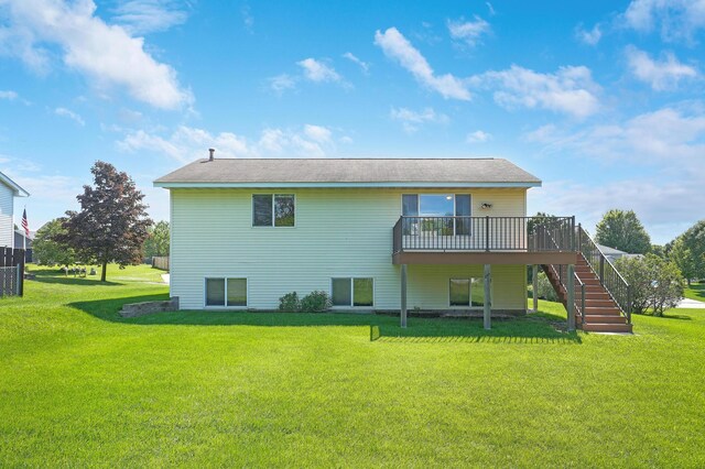 205 4th St NW, Saint Michael, MN 55376 - back of property with stairs, a wooden deck, and a yard