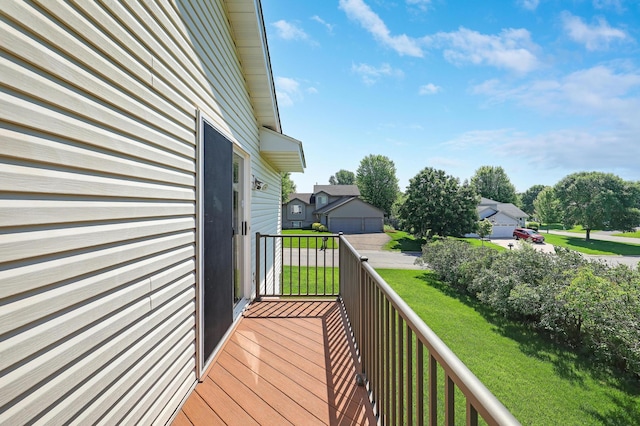 205 4th St NW, Saint Michael, MN 55376 - wooden deck featuring a detached garage and a lawn