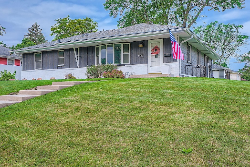 9100 Morgan Ave S, Bloomington, MN 55431 - single story home featuring board and batten siding and a front lawn