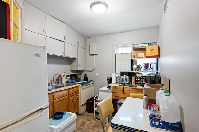 321 6th Ave E, Alexandria, MN 56308 - kitchen with white appliances, white cabinets, and light countertops