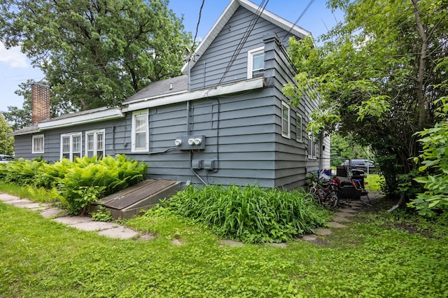 321 6th Ave E, Alexandria, MN 56308 - back of house with a yard and a chimney