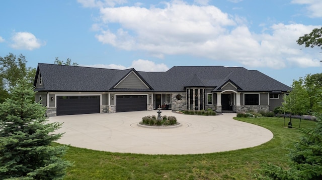1500 Weatherhill Ridge Ct SW, Rochester Twp, MN 55902 - view of front facade with stone siding, curved driveway, a garage, and a front lawn
