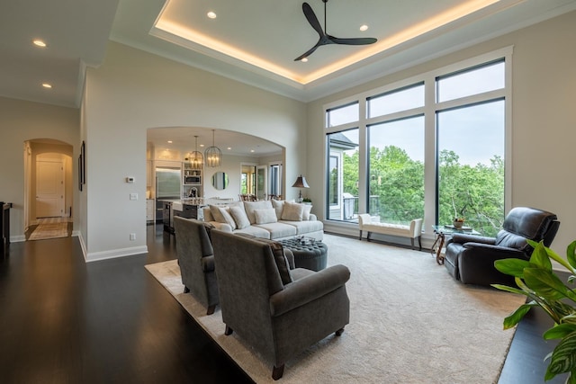 1500 Weatherhill Ridge Ct SW, Rochester Twp, MN 55902 - living room with arched walkways, a towering ceiling, a ceiling fan, recessed lighting, and a chandelier