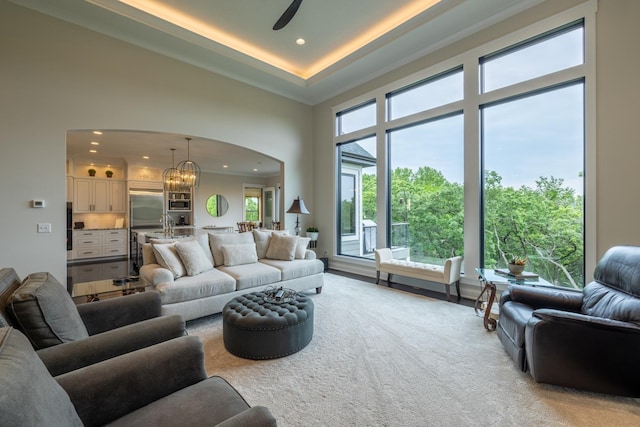 1500 Weatherhill Ridge Ct SW, Rochester Twp, MN 55902 - living area with a towering ceiling, recessed lighting, healthy amount of natural light, a chandelier, and arched walkways