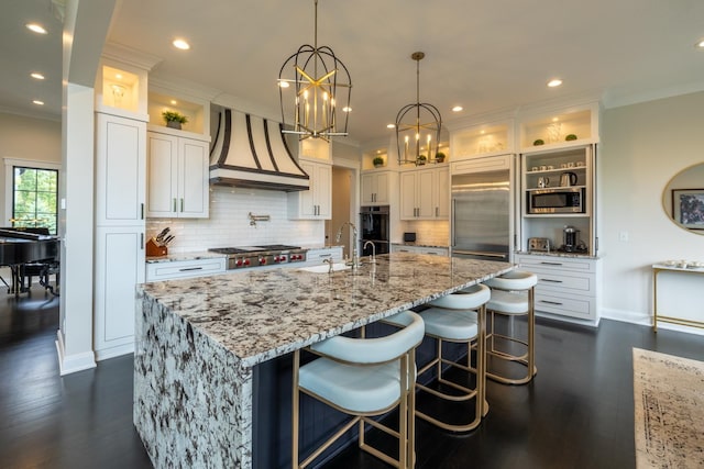 1500 Weatherhill Ridge Ct SW, Rochester Twp, MN 55902 - kitchen featuring custom exhaust hood, built in appliances, crown molding, white cabinetry, and tasteful backsplash