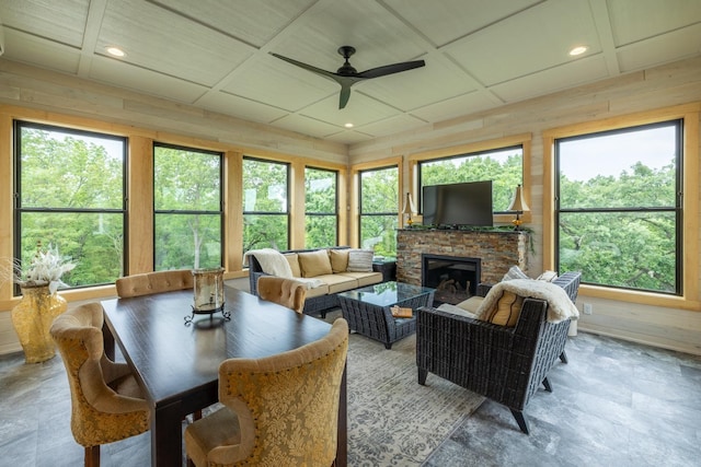 1500 Weatherhill Ridge Ct SW, Rochester Twp, MN 55902 - living area with a ceiling fan, a fireplace, wooden walls, and recessed lighting