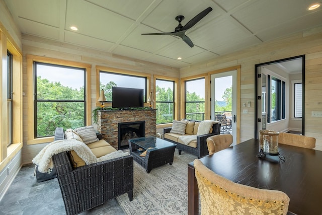 1500 Weatherhill Ridge Ct SW, Rochester Twp, MN 55902 - living room featuring ceiling fan, wood walls, a fireplace, and recessed lighting