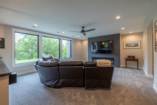 1500 Weatherhill Ridge Ct SW, Rochester Twp, MN 55902 - carpeted living area featuring ceiling fan, recessed lighting, and a fireplace