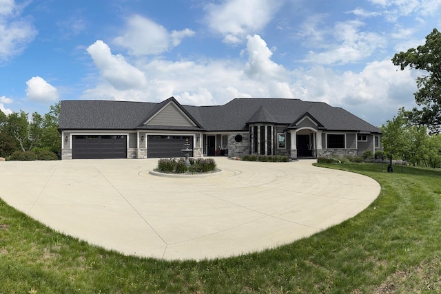 1500 Weatherhill Ridge Ct SW, Rochester Twp, MN 55902 - view of front of home with stone siding, curved driveway, a garage, and a front lawn