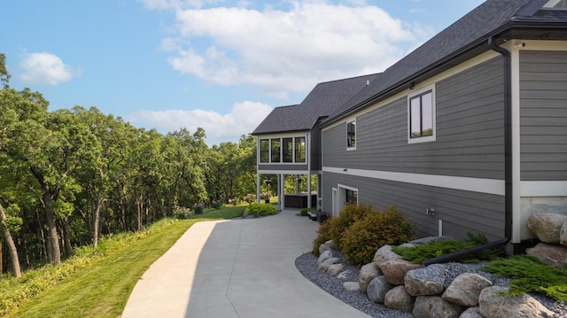 1500 Weatherhill Ridge Ct SW, Rochester Twp, MN 55902 - view of home's exterior featuring a shingled roof
