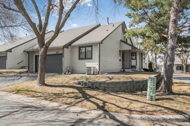 8425 Rice Lake Rd, Maple Grove, MN 55369 - view of front of property featuring a garage and asphalt driveway