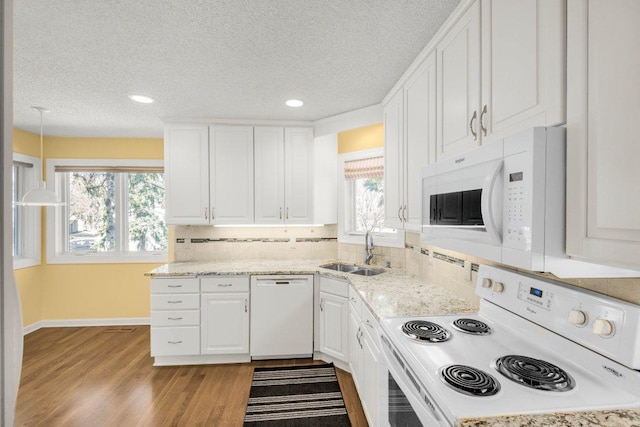 8425 Rice Lake Rd, Maple Grove, MN 55369 - kitchen with white appliances, white cabinets, a textured ceiling, light wood-type flooring, and recessed lighting