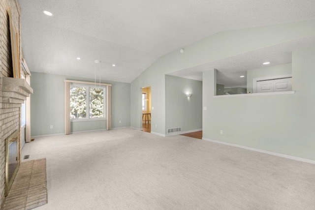 8425 Rice Lake Rd, Maple Grove, MN 55369 - unfurnished living room featuring a fireplace, vaulted ceiling, carpet, and recessed lighting
