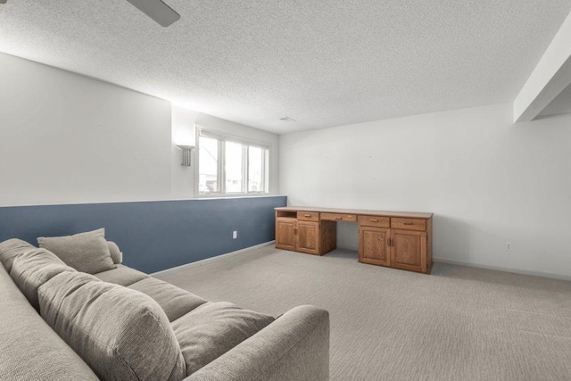 8425 Rice Lake Rd, Maple Grove, MN 55369 - living room with an office area, light carpet, a textured ceiling, and a ceiling fan