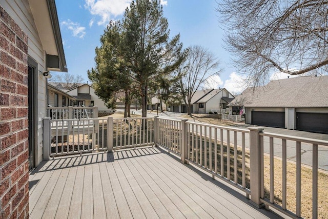 8425 Rice Lake Rd, Maple Grove, MN 55369 - deck featuring a residential view and a detached garage