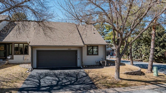 8425 Rice Lake Rd, Maple Grove, MN 55369 - view of front of house with asphalt driveway, a garage, and roof with shingles