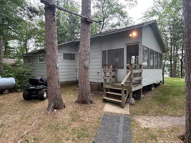 1906 Hay Lake Dr NW, Ponto Lake Twp, MN 56474 - view of front facade with a sunroom