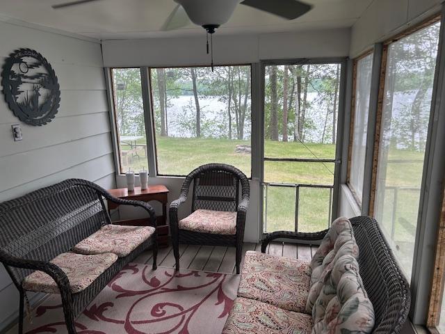 1906 Hay Lake Dr NW, Ponto Lake Twp, MN 56474 - sunroom with a ceiling fan and a water view