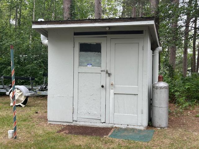 1906 Hay Lake Dr NW, Ponto Lake Twp, MN 56474 - view of shed with view of scattered trees