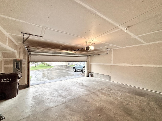 8389 Norwood Ln N, Maple Grove, MN 55369 - garage featuring a garage door opener
