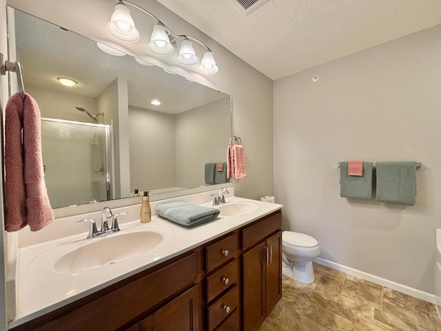 8389 Norwood Ln N, Maple Grove, MN 55369 - bathroom with a stall shower, double vanity, and a textured ceiling