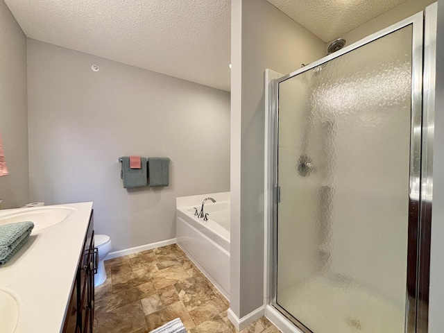 8389 Norwood Ln N, Maple Grove, MN 55369 - bathroom featuring a shower stall, a garden tub, a textured ceiling, stone finish flooring, and double vanity
