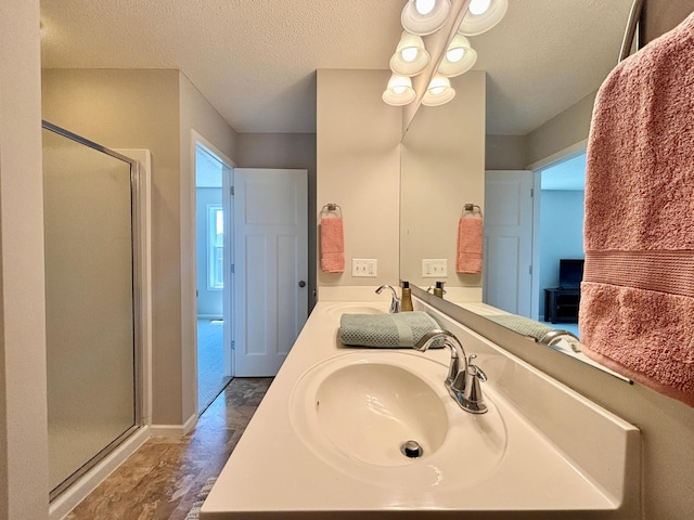 8389 Norwood Ln N, Maple Grove, MN 55369 - full bath with a stall shower, a textured ceiling, and double vanity