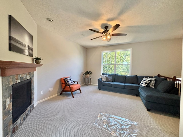 8389 Norwood Ln N, Maple Grove, MN 55369 - carpeted living area with a stone fireplace, a ceiling fan, and a textured ceiling